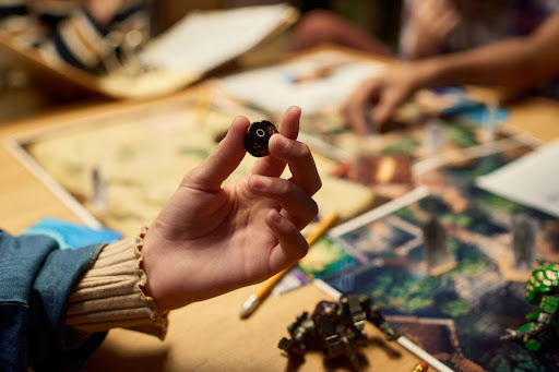 Hand holding polyhedral dice