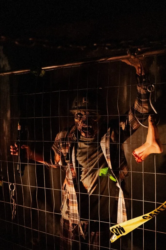 Scary actor behind fence at Padlockd